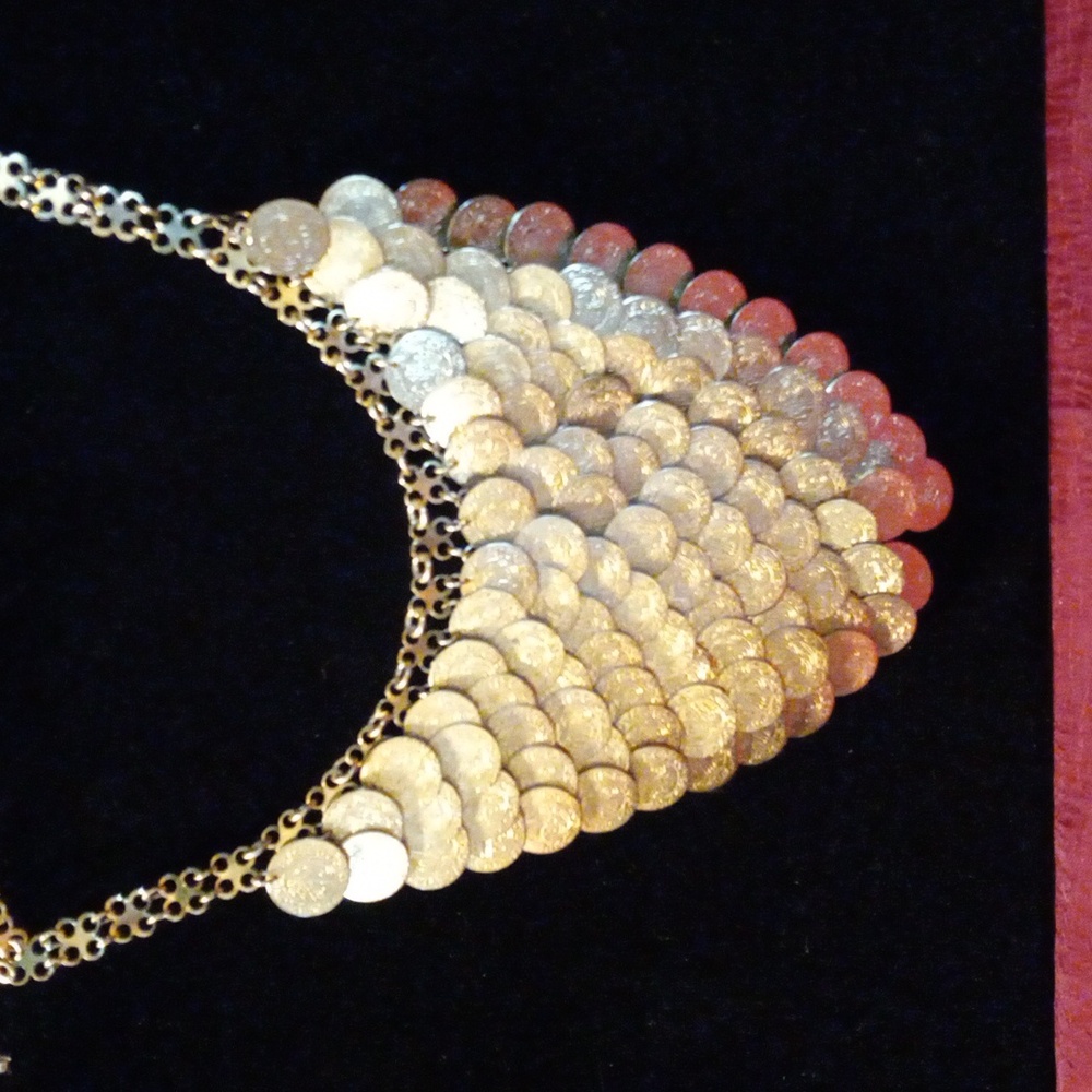 Vintage bib necklace with scaled coins in a matte gold